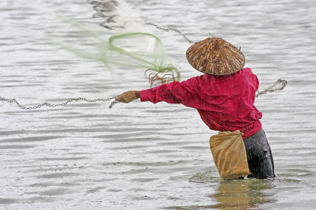 P�cheur Malais sous la pluie
