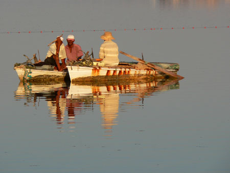 P�cheurs au coucher du soleil