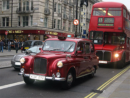 Red cab and bus
