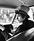 Bob Dylan With Top Hat Pointing In Car, Philadelphia PA 1964 � Daniel Kramer
